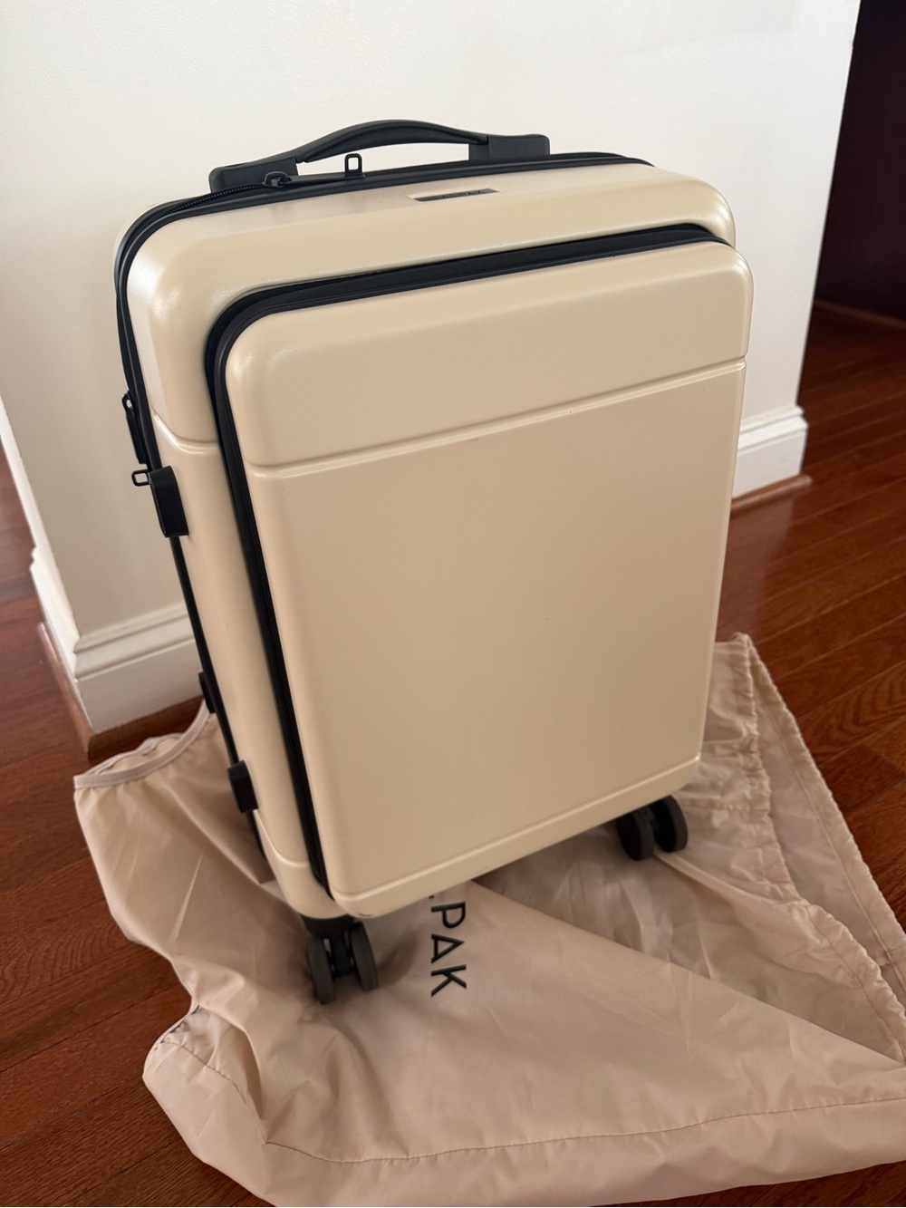Calpak Cream Hardshell Carry-On Spinner with Black Trim